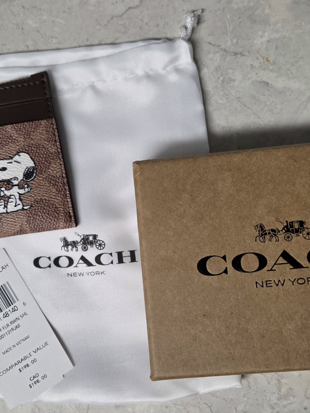 Coach Coach X Peanuts Mini Skinny Id Case In Signature Canvas with Snoopy Print